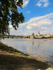 Fototapeta na wymiar A view of Charles Bridge from the Vltava river banks