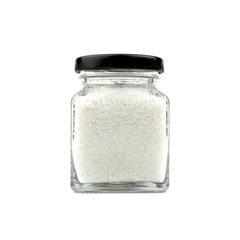 Salt in a glass bottle isolated on white background. Black lid. Modern and stylish. Close up.