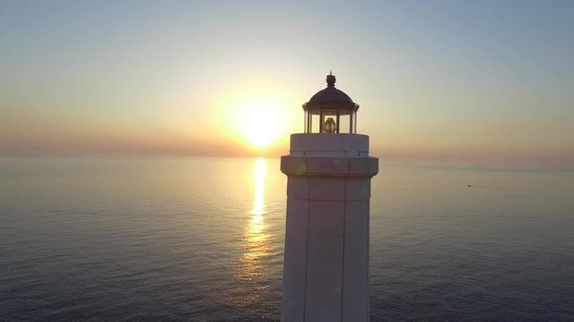 Lighthouse at dawn - aerial view 4k