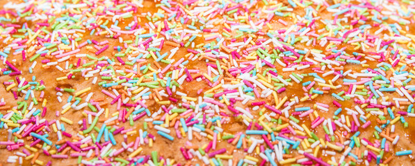 Sugar sprinkle, decoration for cake and bekery, a lot of sprinkles as a background