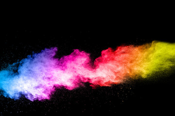 abstract  multicolored powder splatted on black background,Freeze motion of color powder exploding.
