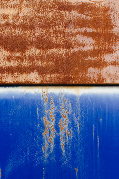 Rusty blue metal garbage container, close up