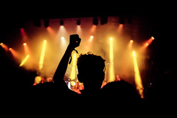 crowd with raised hands at concert - summer music festival