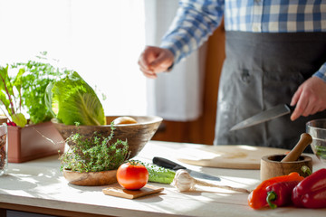 male cooking healthy salad