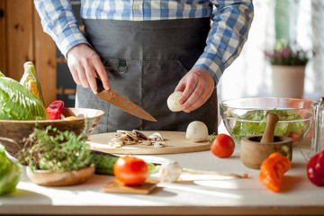 male cooking healthy salad
