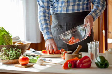 male cooking healthy salad
