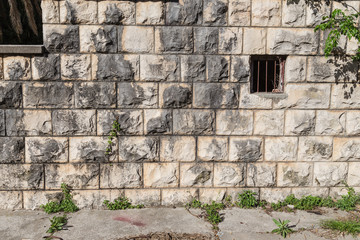 Pattern of the ancient style stone wall with cement.