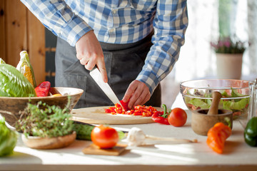 male cooking healthy salad