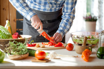 male cooking healthy salad