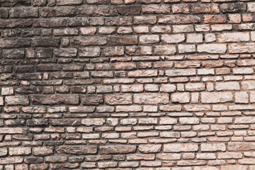 Pattern of the ancient style stone wall with cement.