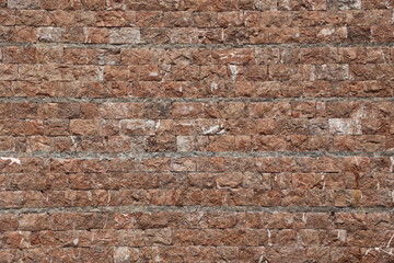 Pattern of the ancient style stone wall with cement.