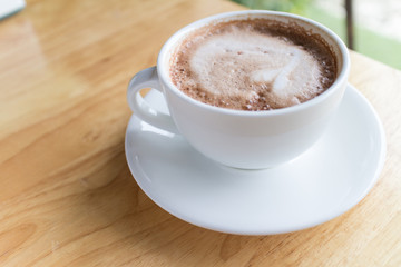 hot coffee mocha with foam milk in countryside cafe
