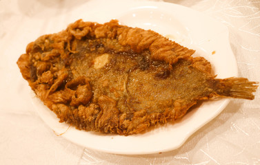 Tasty fish fried on  the white on plate