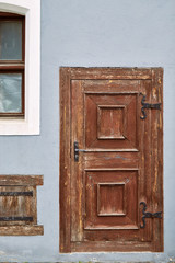 Old brown wooden doors in the old town in Vilnius