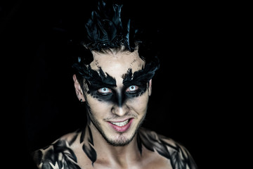 Professional make-up fantastic personag like a raven