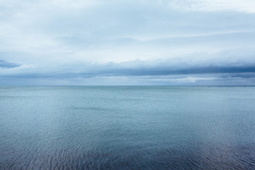 Horizon . Ocean With Cloudy Sky . Blue tones