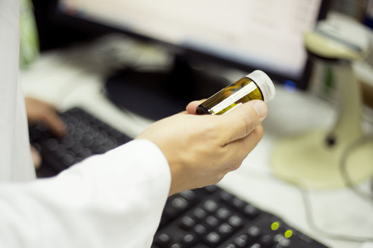 Pharmacist holding pills