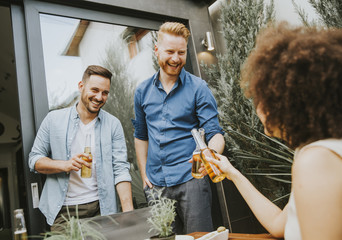 Group of young people having fun in the backyard