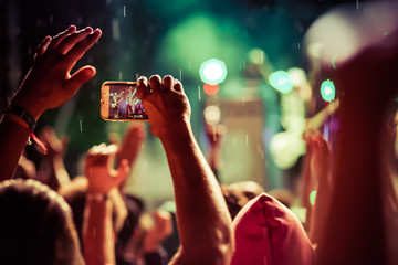 crowd with raised hands at concert - summer music festival