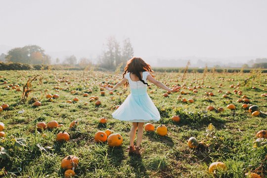 Pretty girl in pumpkin patch