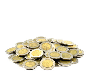 Close up plie of thai coins value 10 bath on white background