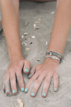 hands in the sand 
