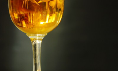 glass of brandy on black background