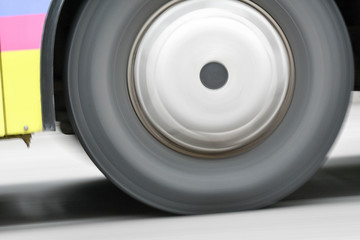 Car moving on streets with rolling wheel