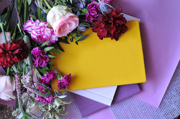 Yellow book of entries for the hidden thoughts of a young girl on a beautiful floral background.
