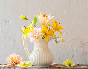 flowers in vase on old white background