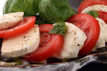 Caprese salad with tomatoes, mozzarella and basil.