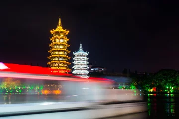 Gordijnen Boat passing buy Guilin twin towers in Guangxi, China © creativefamily