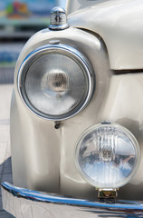 Old car head lights closeup