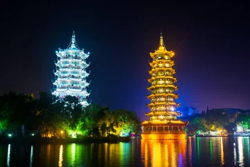 Rolgordijnen Guilin towers in illuminated city park in Guangxi, China © creativefamily