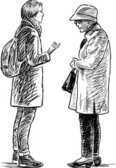 A young girl and elderly woman are talking