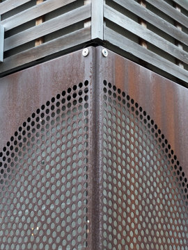 rusty metal patterned cladding joined on a corner