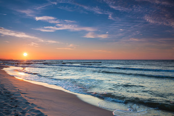 Sunset on the beach on the Baltic Sea - obrazy, fototapety, plakaty