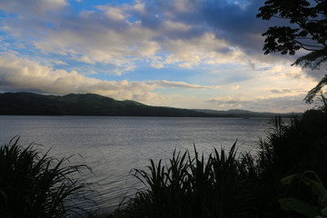Sunset in the lake Arenal Volcano, Costa Rica. Tropical travel. Wanderlust.