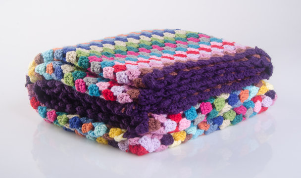 blanket or crochet blanket on a background.