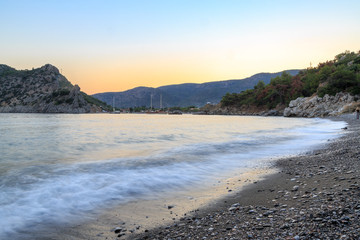 Kizilca buk beach and mesutiye during sunset in Datca, Turkey