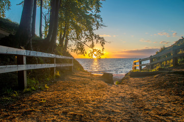 Entrance to the seashore of the Baltic sea in Gdynia druing sunrise.