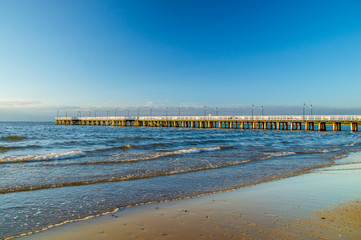 Sunrise with pier at Baltic sea in Gdynia Orlowo.