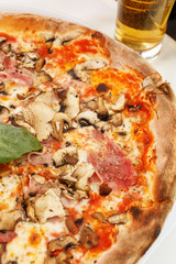 Italian pizza ham mushrooms selective focus
