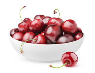 Isolated cherries. Pile of sweet cherry fruits in ceramic bowl isolated on white background with clipping path