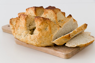 Sliced sourdough bread on a chopping board