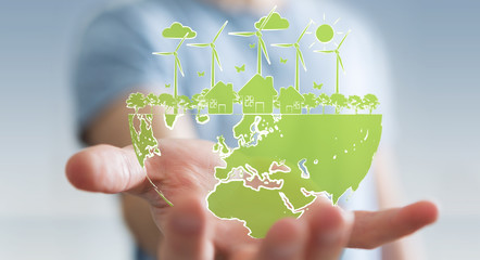 Businessman holding renewable energy sketch