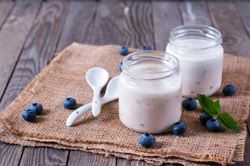 Fresh yogurt with berries in a glass jar