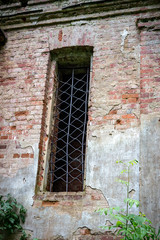 Fototapeta na wymiar Window of the ruined temple of St. Nicholas in the village of Gribny. Russia, Tver region.