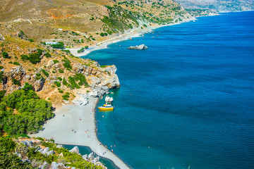 Obraz premium Preveli Beach in Crete island, Greece. There is a palm forest and a river inside the gorge near this beach.