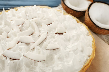Delicious cream pie and coconut halves, closeup